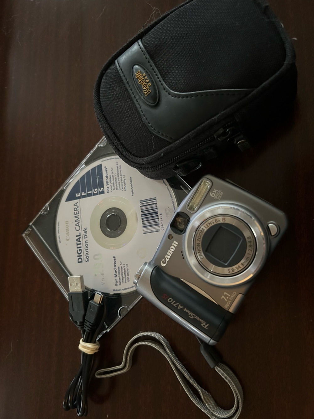 Canon Silver A710 Point-and-Shoot Digital Camera with Black Case and Cable
